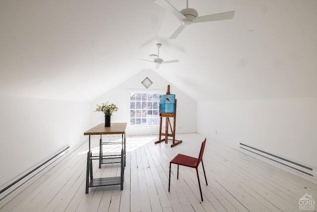 interior space featuring light wood finished floors, lofted ceiling, and a baseboard radiator