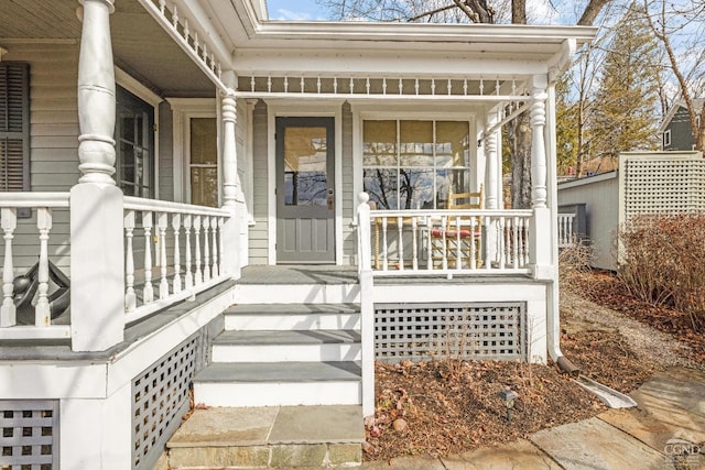 doorway to property featuring covered porch