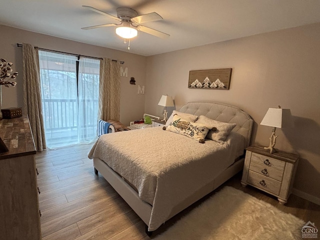 bedroom with wood finished floors, a ceiling fan, and access to exterior