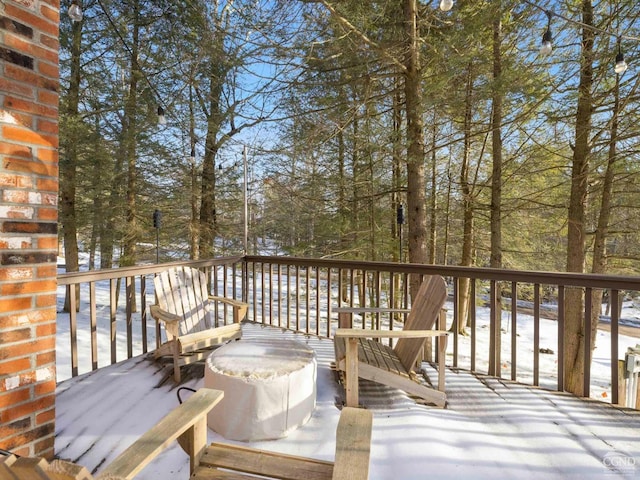 view of snow covered deck