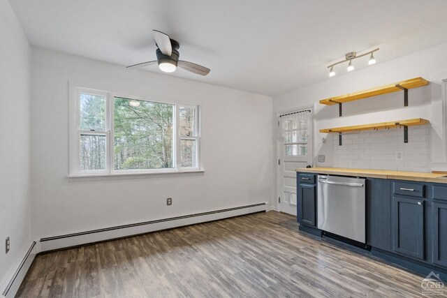 kitchen with decorative backsplash, wooden counters, ceiling fan, a baseboard heating unit, and dishwasher