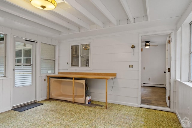 unfurnished sunroom with ceiling fan, beamed ceiling, and a baseboard radiator