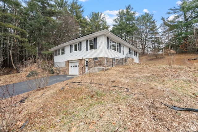 view of front of home with a garage