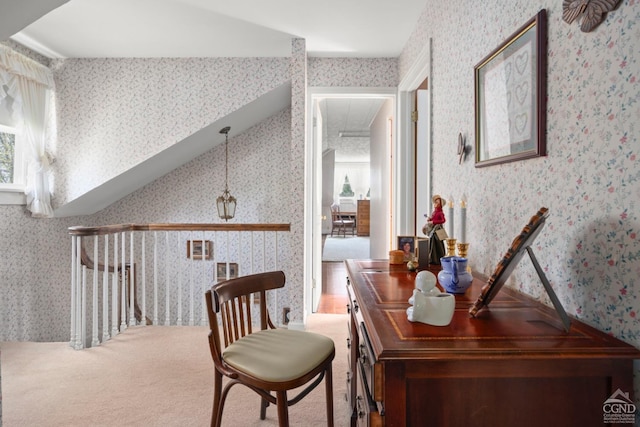 interior space featuring wallpapered walls and attic access