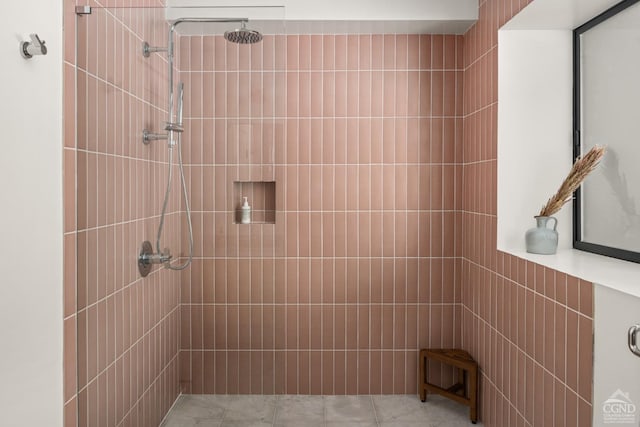 bathroom with tiled shower