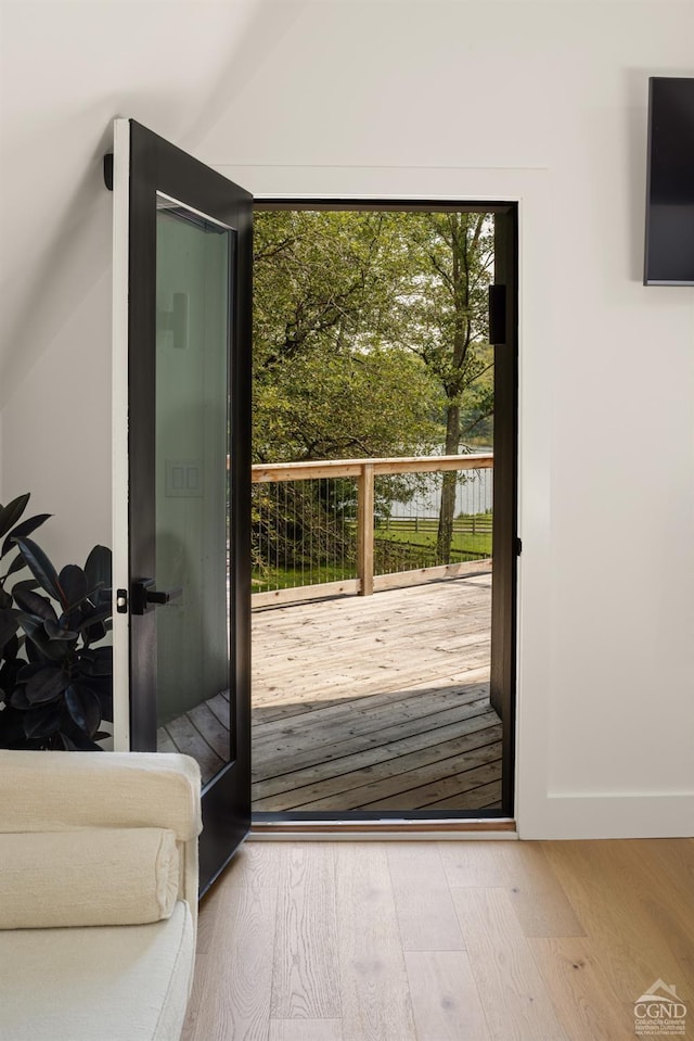 doorway to outside with wood-type flooring