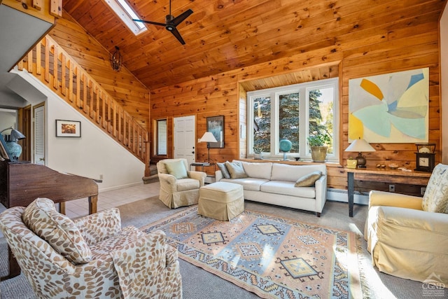 tiled living room featuring high vaulted ceiling, ceiling fan, wooden walls, and wood ceiling