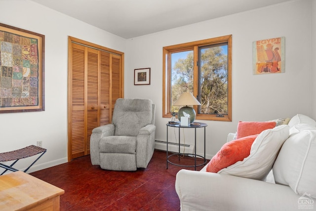 living area with crown molding and baseboard heating