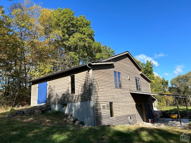 view of side of property featuring a garage