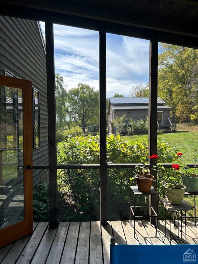 sunroom / solarium featuring plenty of natural light