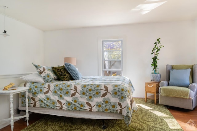 bedroom with wood finished floors