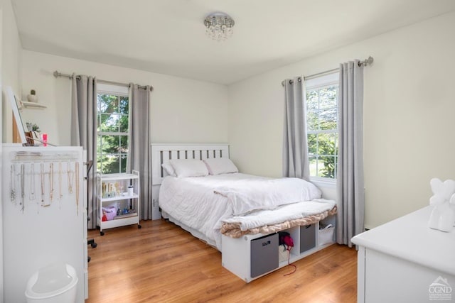 bedroom with light wood-type flooring