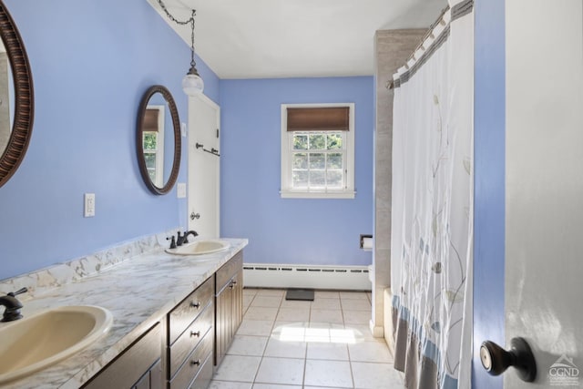 bathroom featuring tile patterned flooring, vanity, a shower with curtain, and a baseboard heating unit