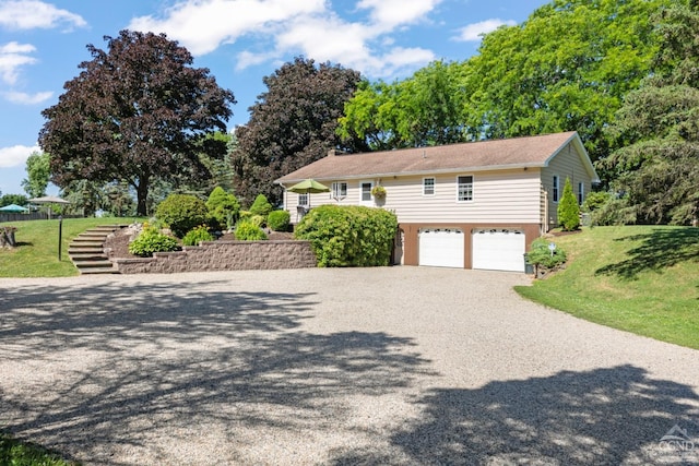 view of home's exterior featuring a yard and a garage