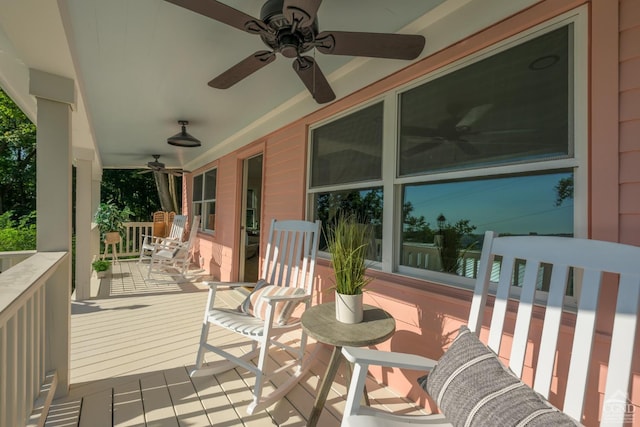 deck with covered porch and ceiling fan