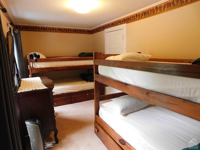 carpeted bedroom featuring ornamental molding