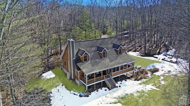 bird's eye view featuring a wooded view