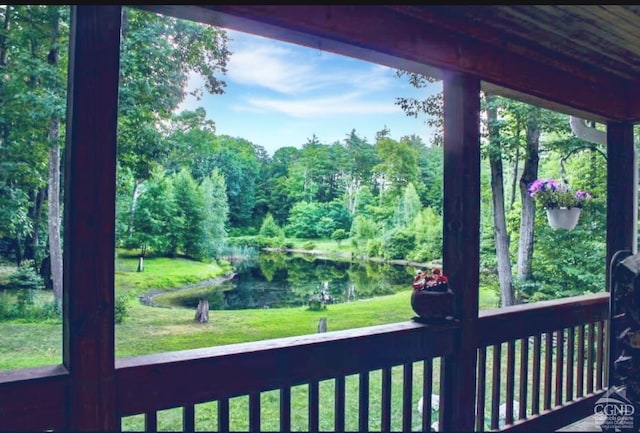 exterior space featuring a yard and a water view