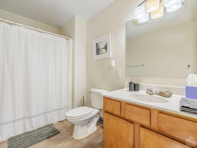 bathroom featuring tile patterned flooring, a shower with shower curtain, vanity, and toilet