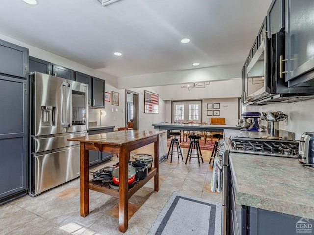 kitchen featuring stainless steel appliances and recessed lighting