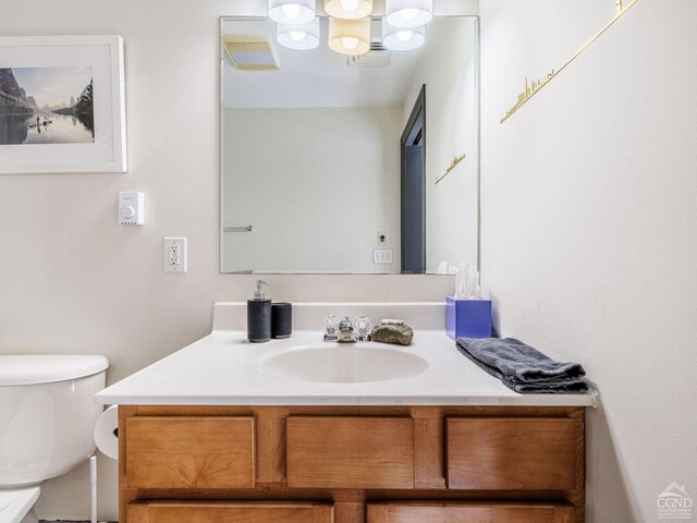 half bath with toilet and vanity