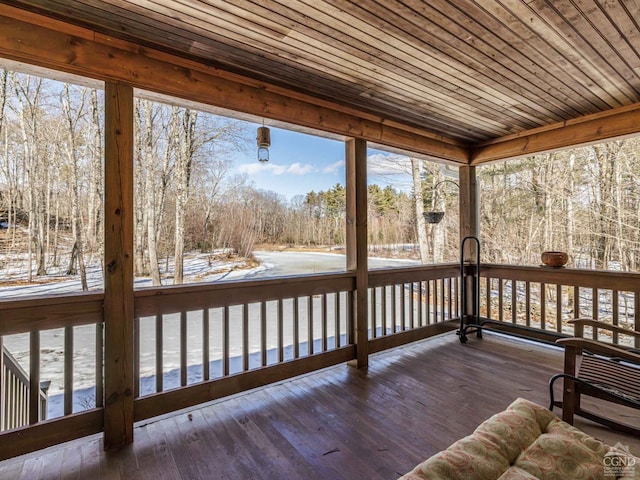 unfurnished sunroom featuring wooden ceiling