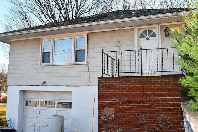 view of side of home featuring a garage