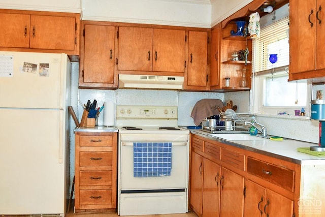 kitchen featuring backsplash, white appliances, and sink