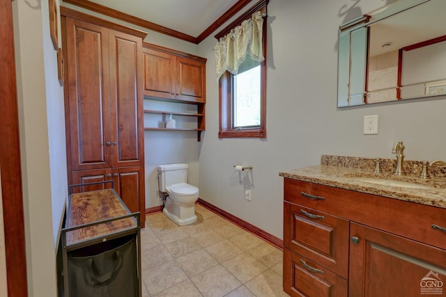 bathroom with tile patterned flooring, vanity, toilet, and crown molding