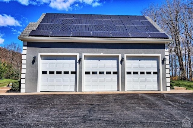 garage featuring solar panels