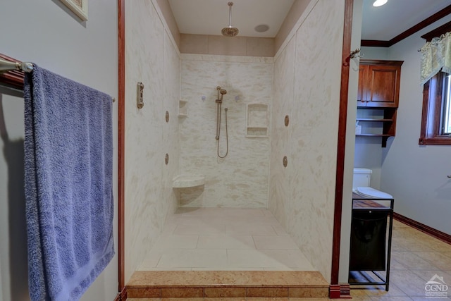 bathroom with tile patterned flooring, a tile shower, and ornamental molding