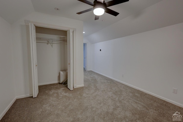 unfurnished bedroom with light carpet, ceiling fan, and lofted ceiling