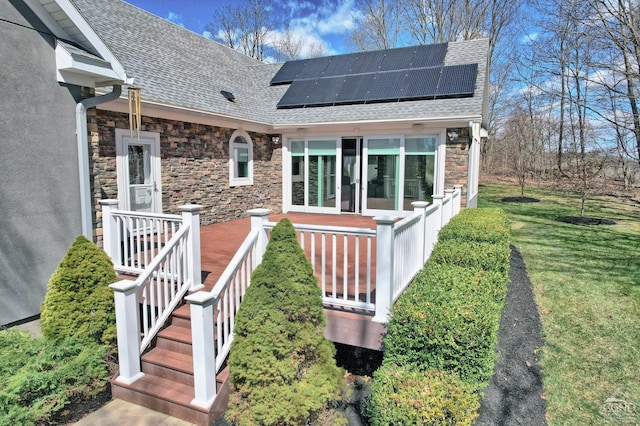 exterior space featuring a yard and solar panels