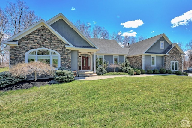 craftsman inspired home with a front lawn