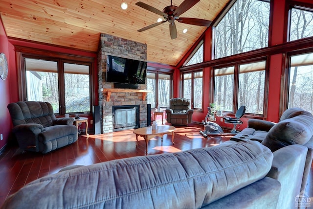 living room featuring hardwood / wood-style floors, wood ceiling, and a wealth of natural light