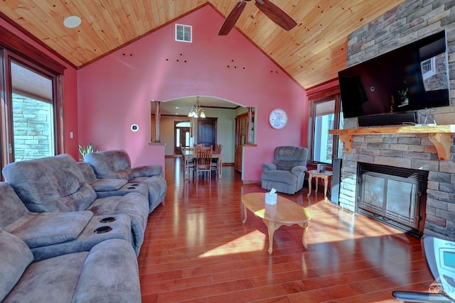 living room with wooden ceiling, a brick fireplace, high vaulted ceiling, hardwood / wood-style floors, and ceiling fan with notable chandelier