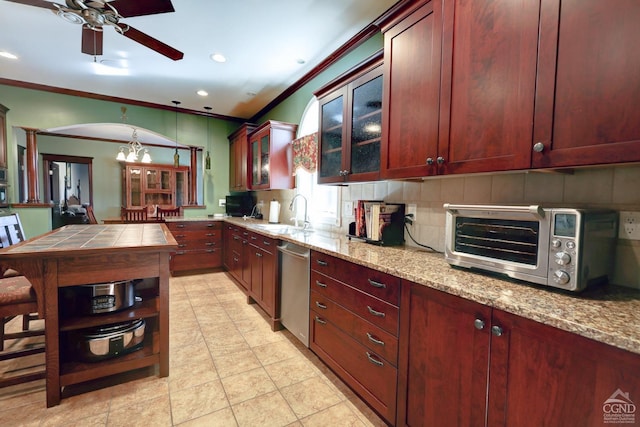 kitchen featuring light stone countertops, backsplash, crown molding, sink, and dishwasher