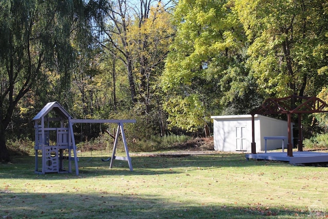 view of yard featuring a storage shed and a playground