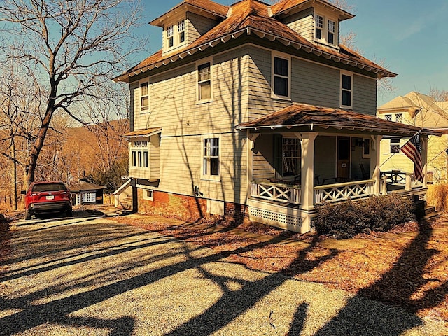 view of home's exterior featuring covered porch