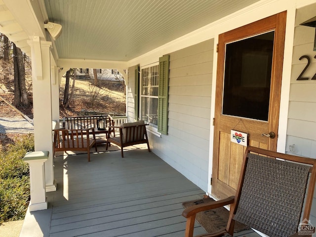 wooden deck featuring covered porch