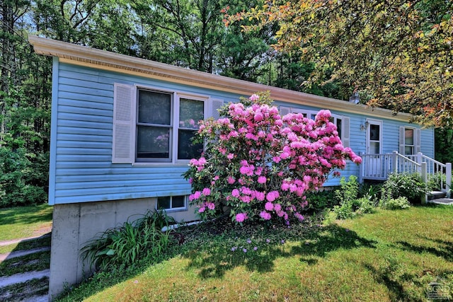 view of property exterior featuring a yard