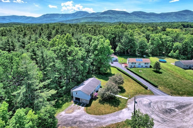 bird's eye view with a forest view and a mountain view