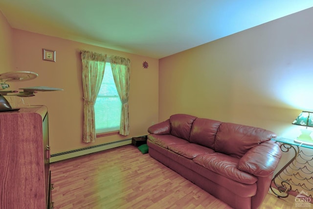 living room featuring baseboard heating and wood finished floors