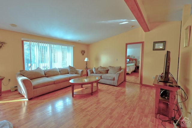 living room with a baseboard heating unit, light wood-type flooring, and lofted ceiling with beams