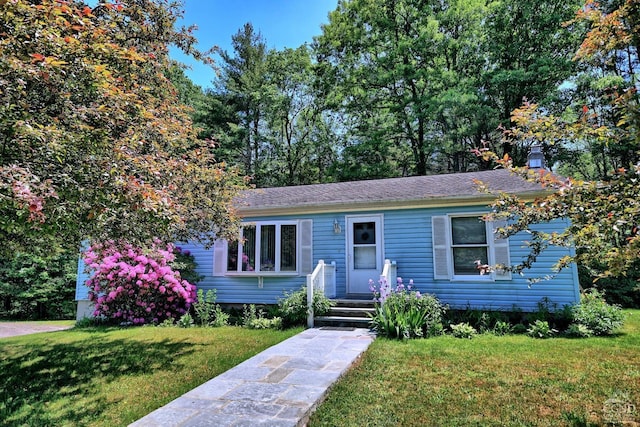 view of front of house with a front lawn