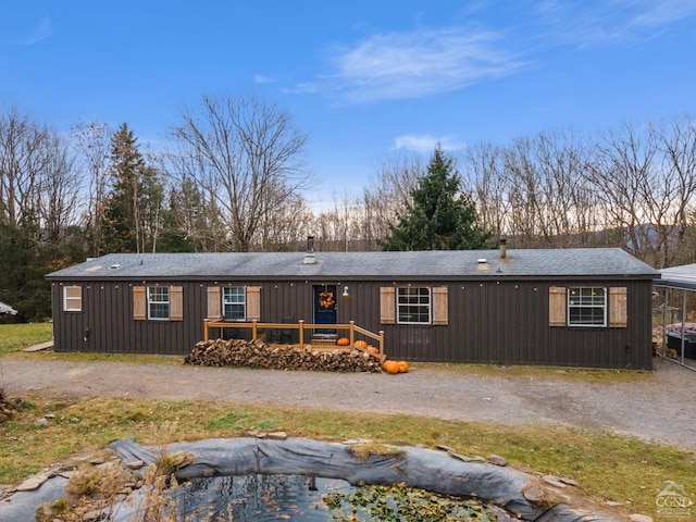 rear view of house featuring a deck