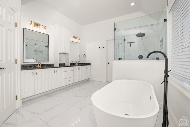 full bathroom featuring a soaking tub, double vanity, marble finish floor, and a marble finish shower