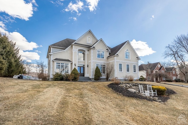 traditional-style house with a front yard