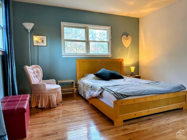 bedroom with light wood-type flooring