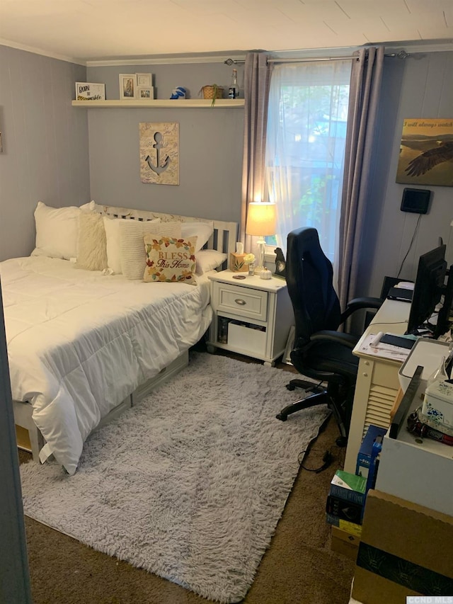 bedroom with dark carpet and ornamental molding